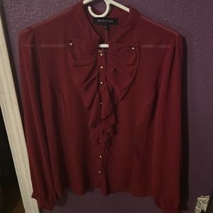 It is a large fits comfortable and the color is burgundy